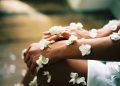 person surrounded by white flowers