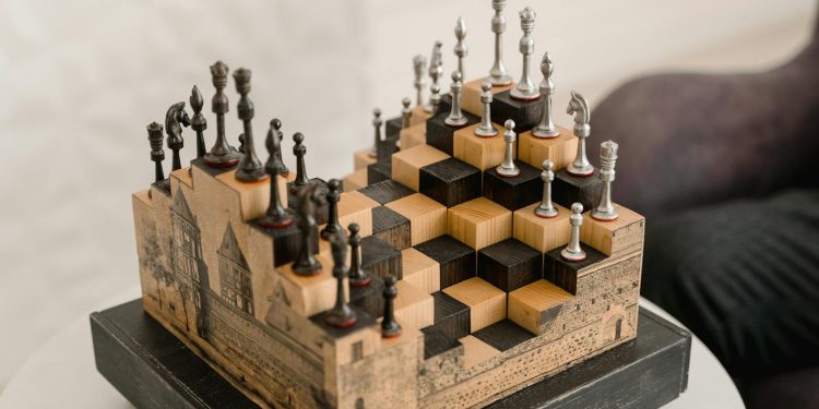 Artistic chess set with 3D pieces on an intricate wooden board indoors.