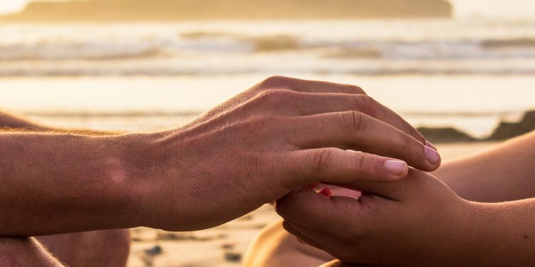 two person holding hands