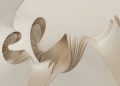 A white sculpture with a curved design on it