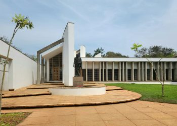 a courtyard with steps leading to a building