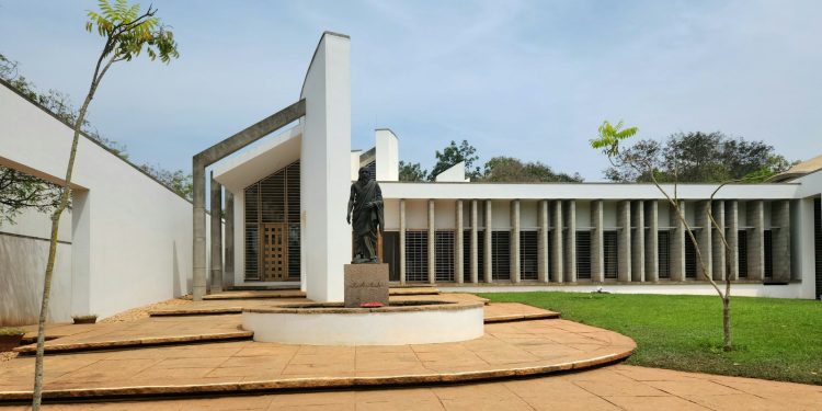 a courtyard with steps leading to a building