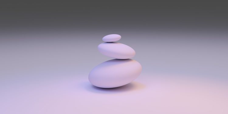 white round stone on white surface