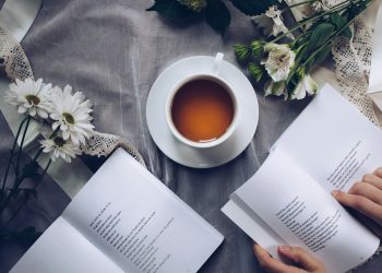 white cup with saucer near bok