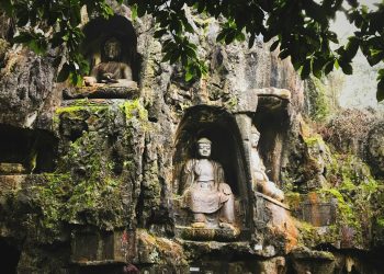 brown concrete statue of man