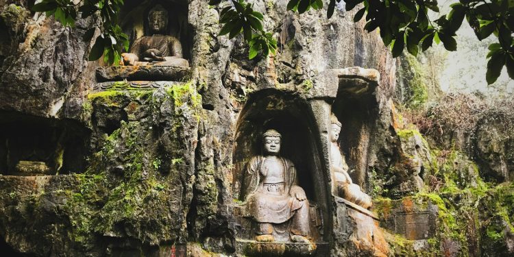 brown concrete statue of man