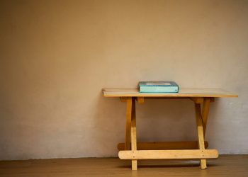 blue book on brown wooden table
