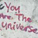 graffiti on a wall that says you are the universe