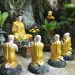 a group of buddha statues sitting next to each other