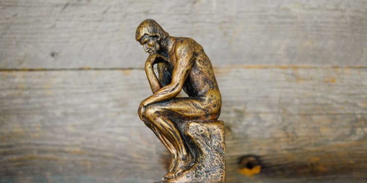 green ceramic statue of a man