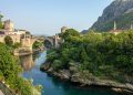 brown concrete bridge over river during daytime