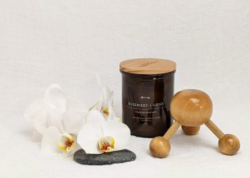 white and brown wooden spoon beside black ceramic mug