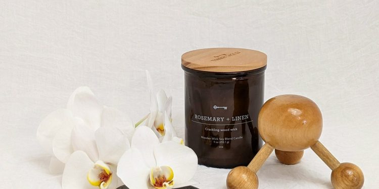 white and brown wooden spoon beside black ceramic mug