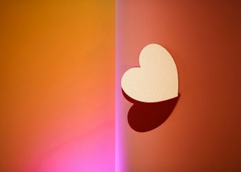 a heart cut out of a piece of paper