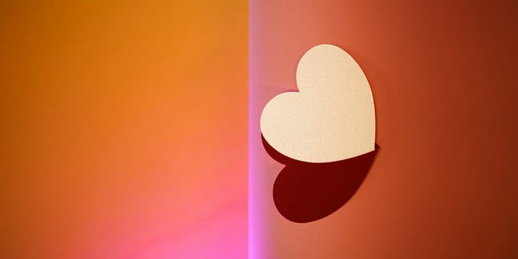 a heart cut out of a piece of paper