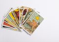 a deck of tarot cards on a white surface