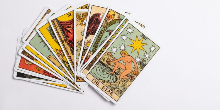 a deck of tarot cards on a white surface