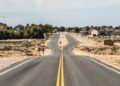 gray asphalt road under white sky during daytime