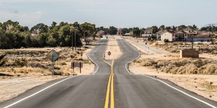 gray asphalt road under white sky during daytime