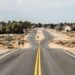 gray asphalt road under white sky during daytime