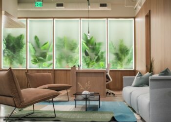 brown wooden table near white couch