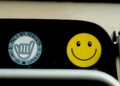 a close up of a traffic light with a smiley face