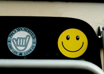 a close up of a traffic light with a smiley face