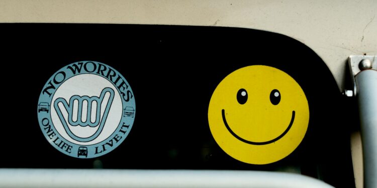 a close up of a traffic light with a smiley face