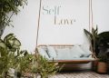brown rattan swing bench with cushions