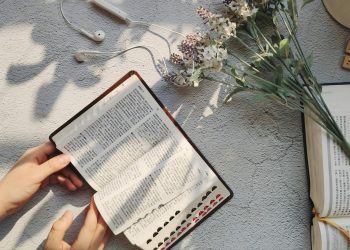 person holding white printer paper